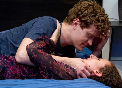 Matt Holzfeind and Kristina Valada-Viars in bed