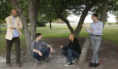 Usman Ally and Collin Geraghty, doubled, beneath a tree
