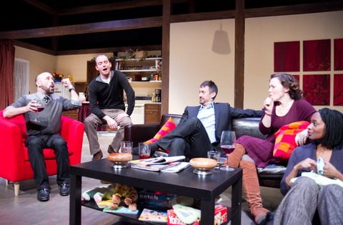 The full cast of This on the living-room set