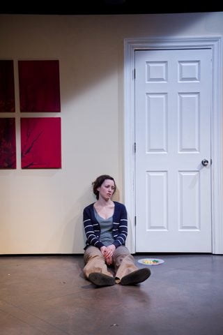 Rebecca Spence as Jane alone on the floor in This