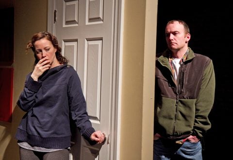Rebecca Spence and John Byrnes in a doorway in This